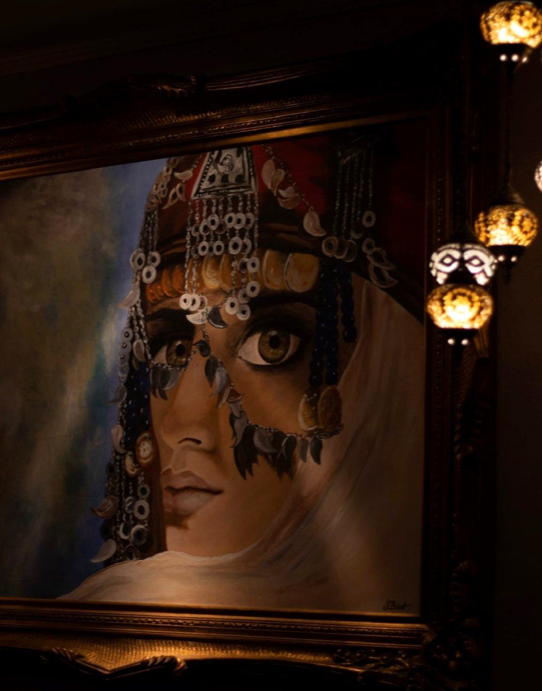 Hand-painted portrait and mosaic lamps in the dining room